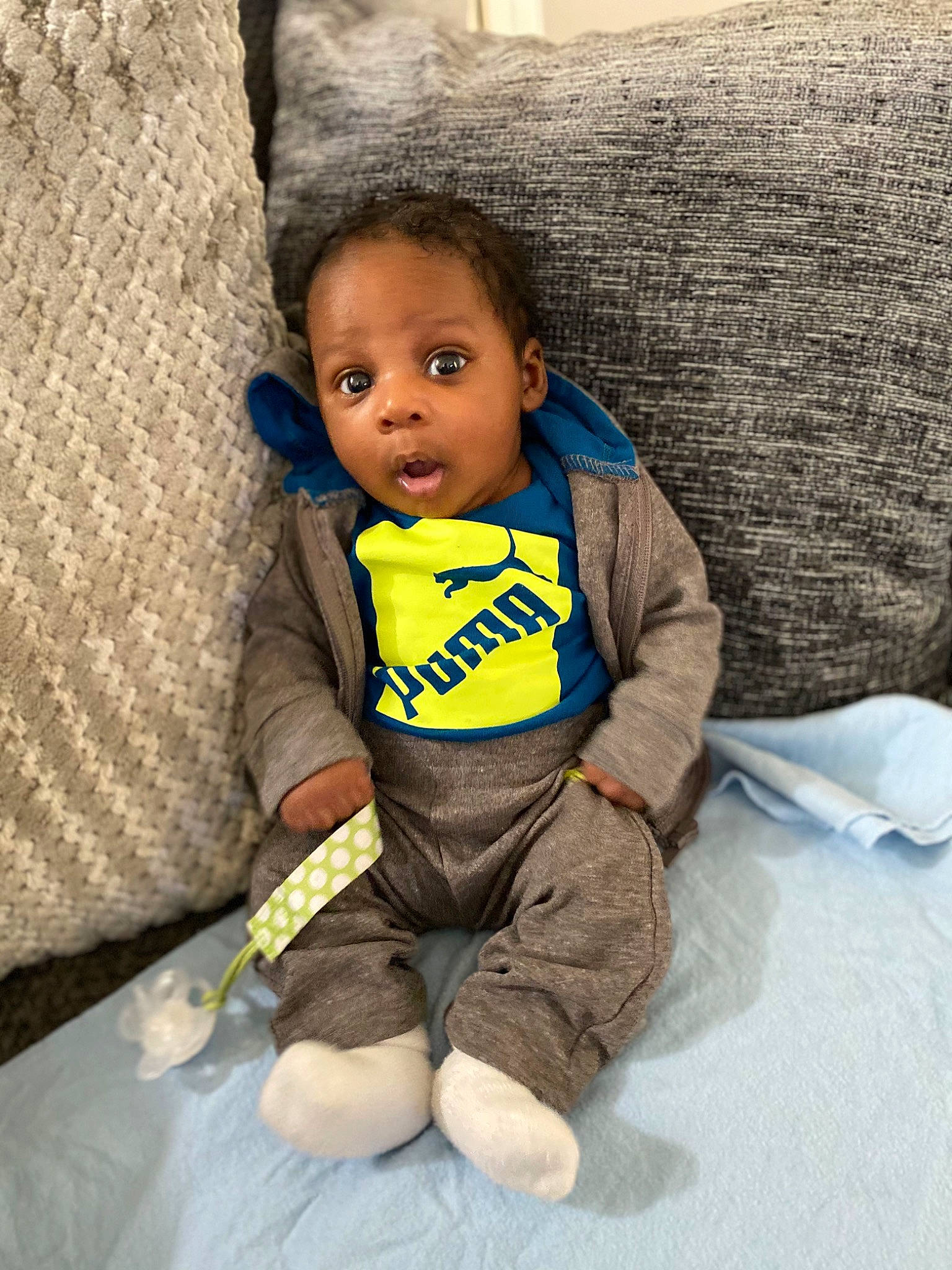 Mekhai joined the competition — help win amazing prizes! arm, baby, baby_toddler_clothing, comfort, eye, facial_expression, finger, hair, hand, happy, human_body, nose, outerwear, person, skin, sleeve, smile, surprise, t_shirt, textile