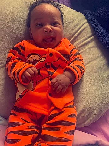 Mekhai joined the competition — help win amazing prizes! arm, baby, baby_toddler_clothing, bedtime, cheek, child, comfort, cool, eye, face, happy, head, human_body, linens, mouth, nose, orange, person, skin, sleeve