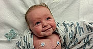 Waylon joined the competition — help win amazing prizes! baby, infant, smiling, medical, electrodes, blanket, cactus_pattern, diaper, hospital, cute, skin, face, lying_down, healthcare, monitoring, newborn, child, expression, indoors, resting