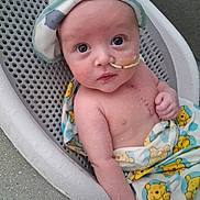 Waylon joined the competition — help win amazing prizes! baby, infant, feeding_tube, blanket, winnie_the_pooh, hat, basket, skin, cute, child, newborn, indoors, portrait, lying_down, medical, hospital, young, face, person, healthcare