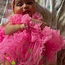 baby, child, smiling, pink, tutu, headband, blanket, infant, cute, happy, patterned, clothing, laying, portrait, face, hands, legs, indoors, soft_lighting, colorful