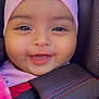 Kailani is registered to the contest to win money with this photo: baby, infant, smile, headband, pink, car_seat, blanket, child, cute, face, closeup, happy, apparel, seatbelt, adorable, person, young_child, chubby_cheeks, portrait, cozy