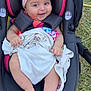 Kailani joined the competition — help win amazing prizes! baby, infant, car_seat, pink_bow, blanket, smiling, outdoor, grass, child, cute, headband, person, sitting, happy, clothing, foot, hand, seatbelt, portrait, closeup
