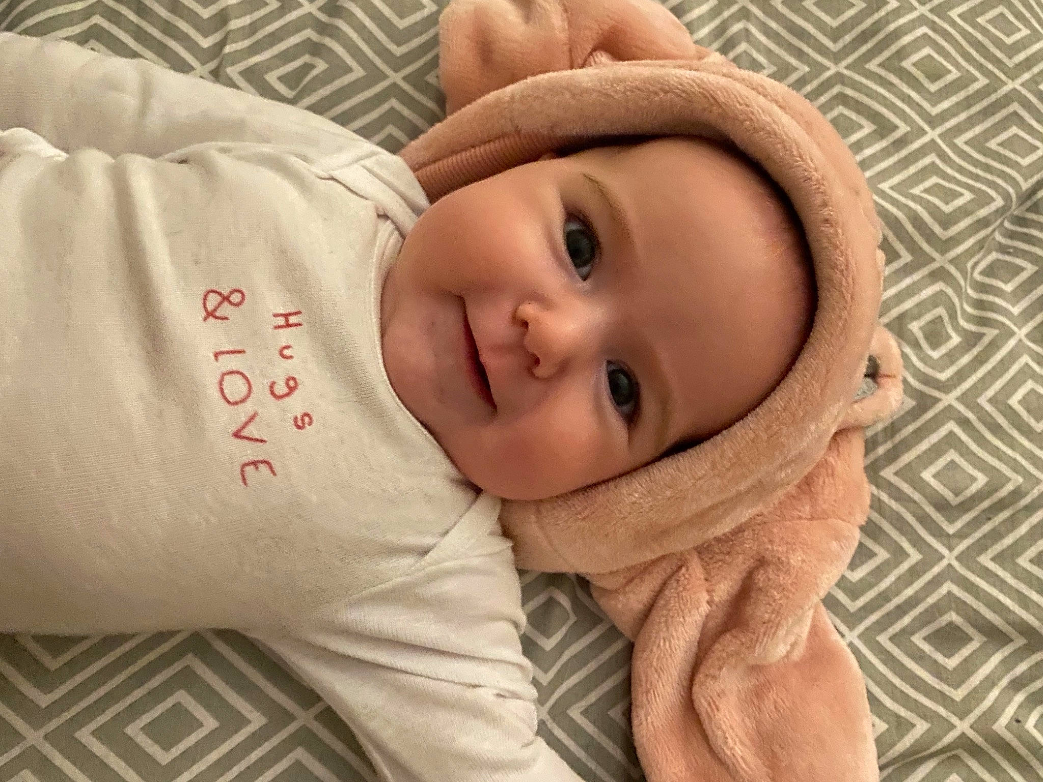 Lyana participe au concours pour gagner de l'argent avec cette photo : baby, cheek, comfort, eye, eyebrow, eyelash, finger, gesture, happy, head, headwear, lip, mammal, mouth, nose, person, skin, sleeve, smile, textile