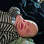 Brodie joined the competition — help win amazing prizes! baby, sleeping, infant, hand, face, striped_clothing, blanket, cozy, peaceful, closeup, newborn, resting, soft, cute, child, portrait, indoors, person, relaxation, nap