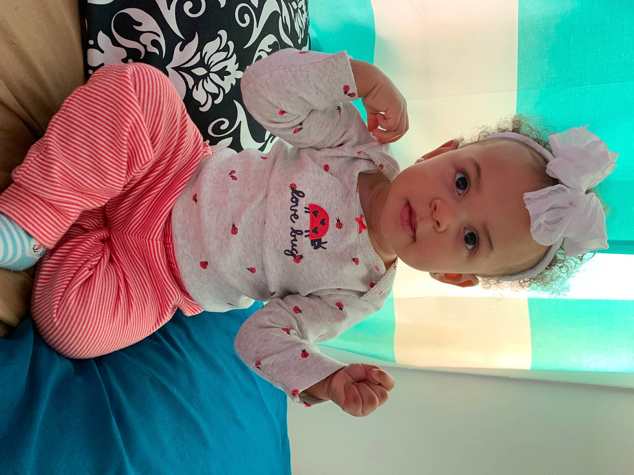 Mahloni is registered to the contest to win money with this photo: baby, baby_products, baby_toddler_clothing, baby_toys, cheek, child, comfort, happy, linens, pattern, person, pink, play, room, skin, sleeve, sock, toddler