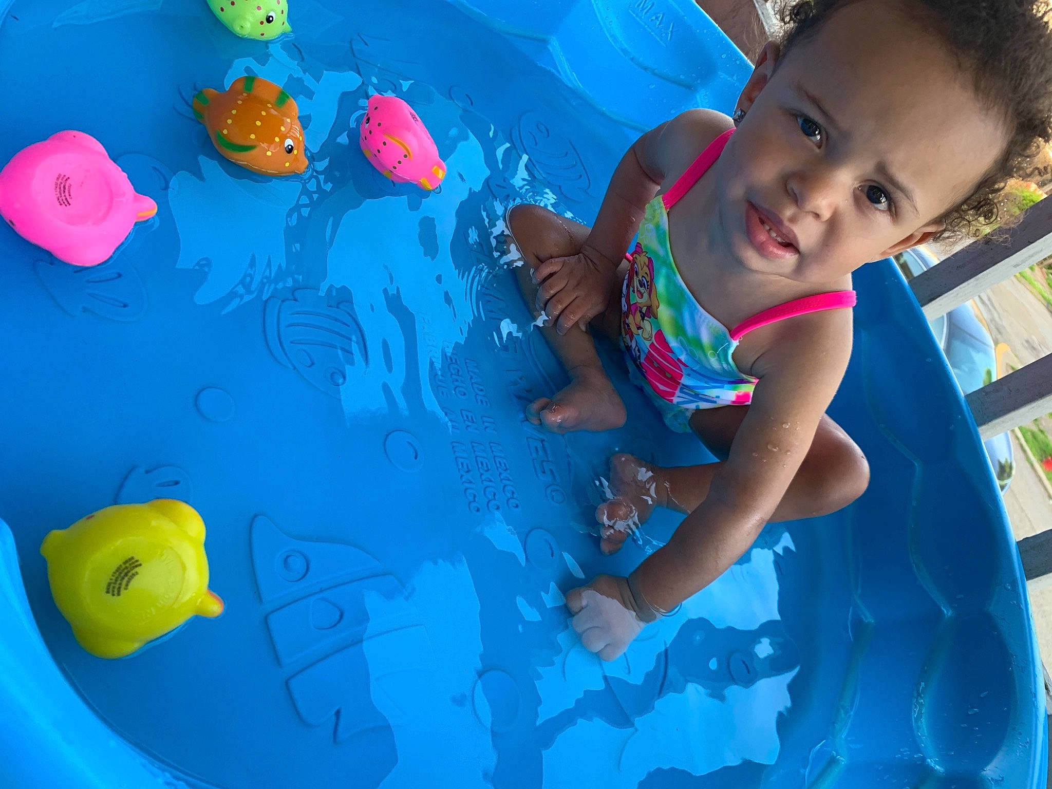 Mahloni is registered to the contest to win money with this photo: aqua, azure, baby, baby_toddler_clothing, blue, child, design, electric_blue, facial_expression, fun, games, happy, leisure, person, recreation, red, swimming_pool, toddler, water, world