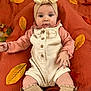 baby, child, infant, autumn, fall_leaves, blanket, headband, cute, portrait, clothing, socks, buttoned_outfit, indoor, lying_down, soft_texture, orange, yellow, brown, hands, legs