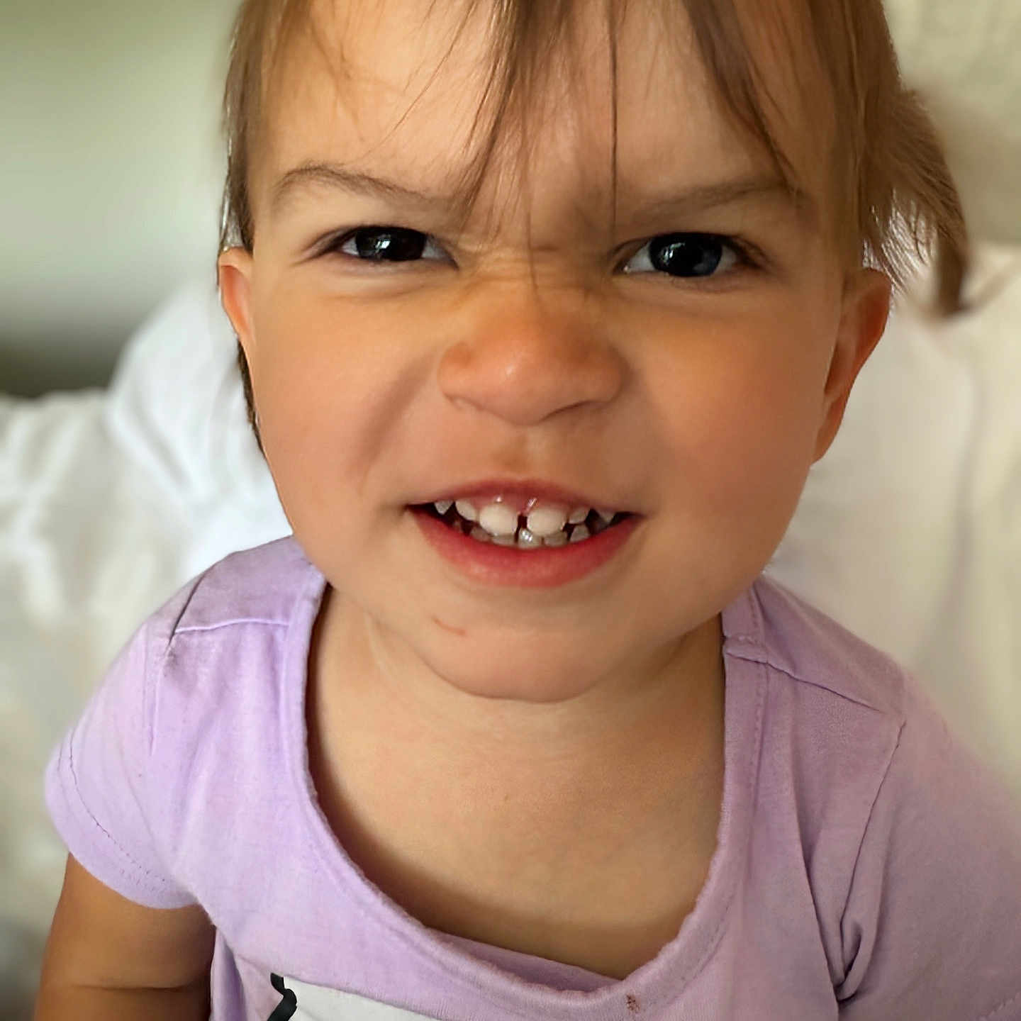 Katya joined the competition — help win amazing prizes! child, closeup, clothing, cute, expression, eyes, face, hair, hello_kitty, indoor, person, playful, portrait, purple_shirt, sitting, smile, teeth, toddler, white_background, young_child