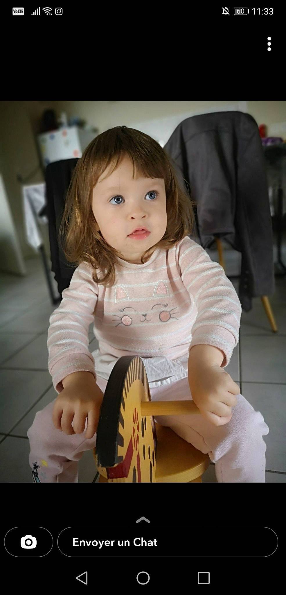 Tessa participe au concours pour gagner de l'argent avec cette photo : baby, baby_toddler_clothing, chair, cheek, child, event, eye, face, flash_photography, hair, happy, head, human_leg, idiophone, membranophone, musical_instrument, person, sitting, skin, sleeve