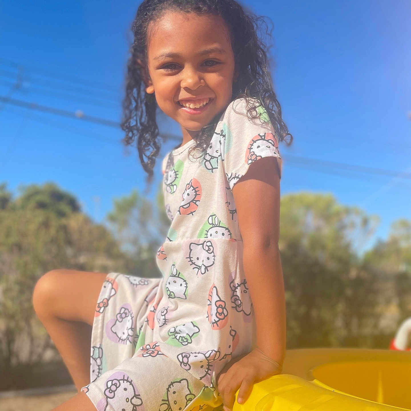 Zendaeya is registered to the contest to win money with this photo: beachwear, blackhair, child, clothing, dimples, face, female, girl, hair, happy, head, outdoorplayarea, outdoors, person, photography, playarea, portrait, sitting, sleeve, smile