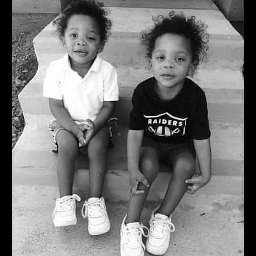 Ez. Ih. is registered to the contest to win money with this photo: black_and_white, casual_clothing, children, concrete, curly_hair, front_door, front_porch, happy, monochrome, outdoor, pair, portrait, siblings, sitting, smiling, sneakers, steps, toddler, two_children, young_kids