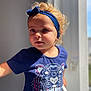 Yenna participe au concours pour gagner de l'argent avec cette photo : blue_shirt, casual_clothing, child, curly_hair, cute, daylight, expression, face, headband, indoor, looking_away, natural_light, person, portrait, short_sleeves, standing, tiger_graphic, toddler, window_light, young_child