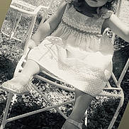 Juila joined the competition — help win amazing prizes! child, girl, dress, shoes, chair, outdoor, grass, black_and_white, portrait, curious, young, sitting, metal, sunlight, shadow, cute, fashion, person, daytime, nature