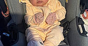 Juila is registered to the contest to win money with this photo: adorable, apparel, baby, baby_garment, car_seat, car_seat_strap, child, clothing, cozy, cute, face, hood, indoors, infant, mittens, newborn, person, safety, seat, socks