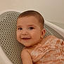 Ella joined the competition — help win amazing prizes! baby, child, smile, face, skin, happy, bath, bathtub, cloth, fabric, seat, white, orange, infant, cute, portrait, indoors, childcare, person, young