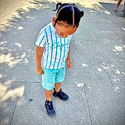 Kaadync joined the competition — help win amazing prizes! child, boy, standing, pavement, outdoor, daylight, shadows, braided_hair, striped_shirt, shorts, sneakers, looking_down, person, casual_clothing, sunlight, sidewalk, street, urban, summer, footwear