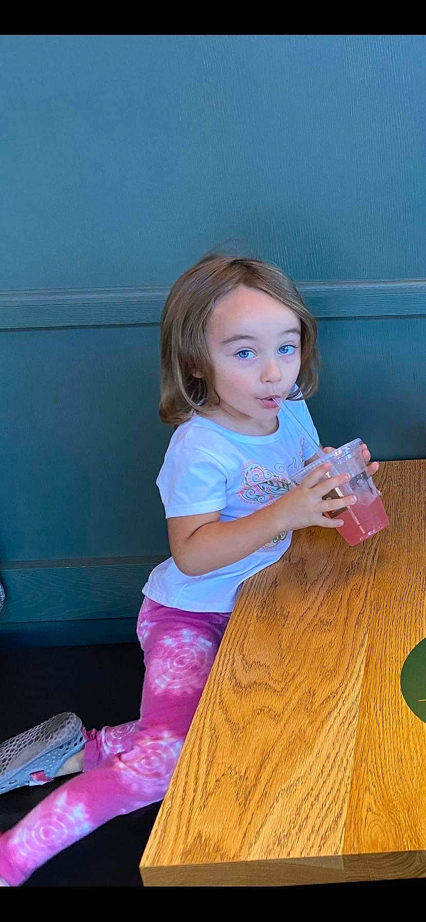 Kyra joined the competition — help win amazing prizes! baby_toddler_clothing, blond, child, electric_blue, floor, flooring, fun, happy, hardwood, long_hair, magenta, person, pink, play, purple, sitting, tableware, toddler, varnish, wood