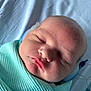 Jayden is registered to the contest to win money with this photo: newborn, baby, sleeping, blanket, mint_green, closeup, face, infant, swaddled, soft, peaceful, skin, hospital, head, person, resting, indoors, cute, child, portrait