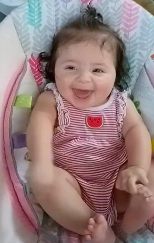 Mariyana is registered to the contest to win money with this photo: baby, baby_toddler_clothing, cheek, chin, comfort, eye, face, happy, head, iris, joy, lip, neck, nose, person, pink, product, skin, sleeve, smile