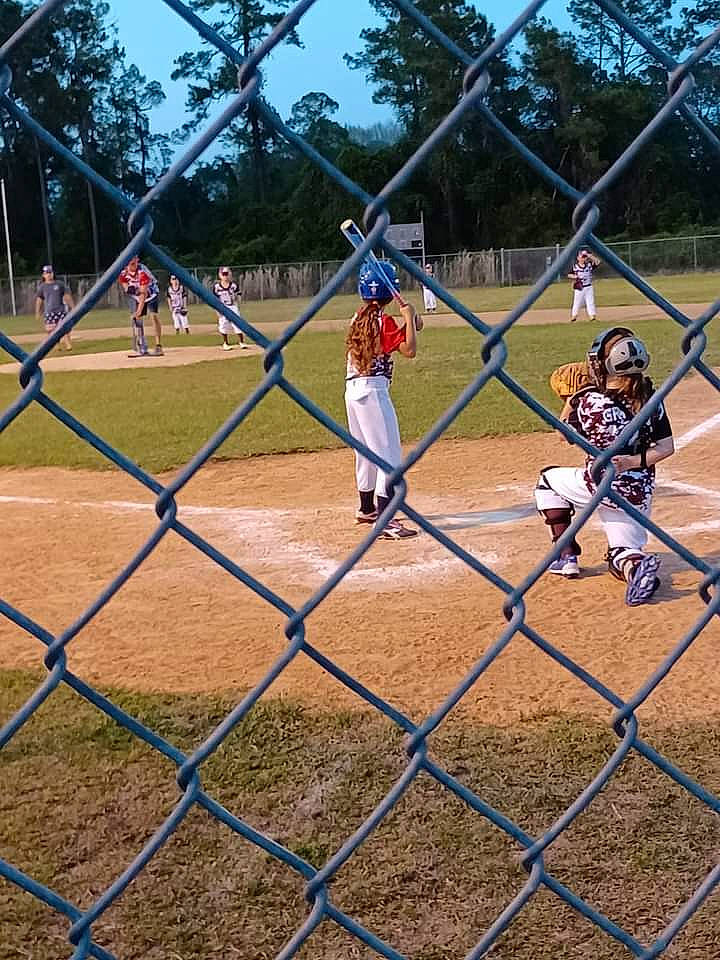 Brianna is registered to the contest to win money with this photo: baseball, baseball_equipment, baseball_field, baseball_park, baseball_player, baseball_positions, baseball_protective_gear, baseball_uniform, bat_and_ball_games, batting_glove, batting_helmet, college_baseball, fence, helmet, mesh, person, sports_equipment, sports_gear, sports_uniform, tree