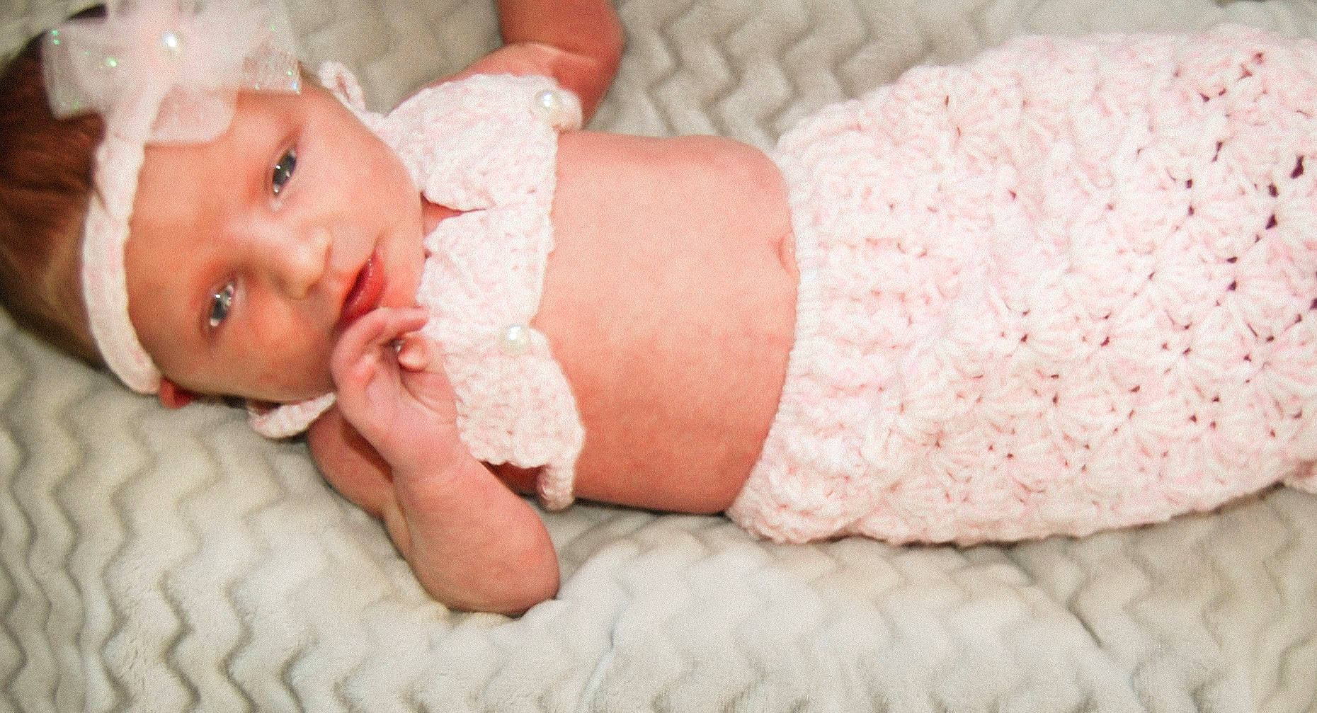Brayleigh is registered to the contest to win money with this photo: arm, baby, baby_sleeping, baby_toddler_clothing, child, comfort, dress, embellishment, finger, hair_accessory, hand, headwear, human_body, linens, nail, pattern, person, pink, skin, sleeve