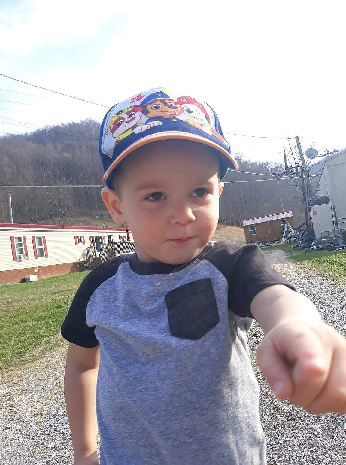 Reed is registered to the contest to win money with this photo: baby, baby_toddler_clothing, baseball_cap, cap, cloud, electric_blue, face, fashion_accessory, fun, grass, happy, hat, headwear, leisure, person, plant, sky, sleeve, smile, t_shirt