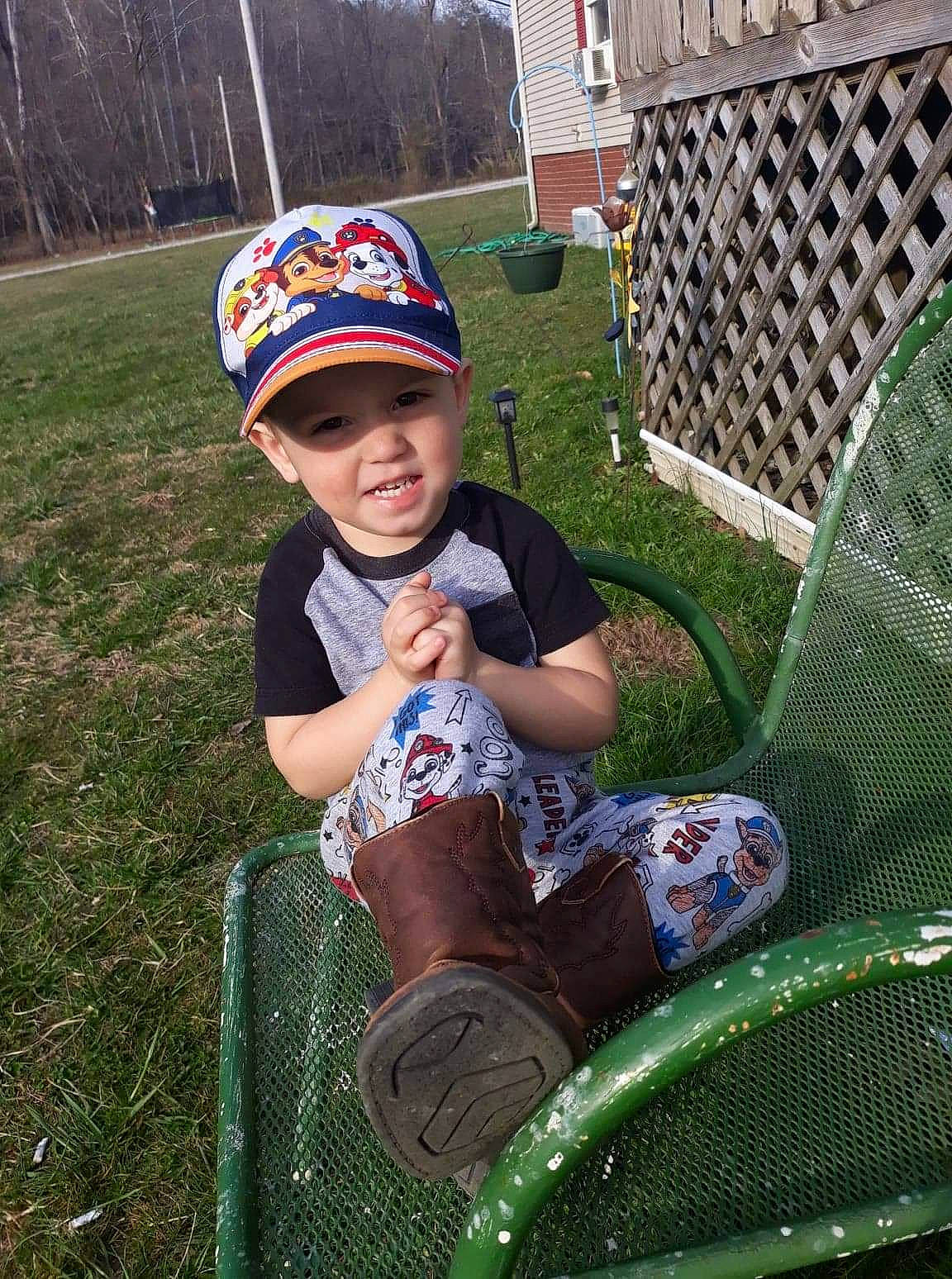 Reed joined the competition — help win amazing prizes! automotive_tire, baby_toddler_clothing, baseball_cap, cap, child, fun, grass, headwear, lawn, leisure, mammal, mesh, person, plant, public_space, recreation, smile, sports_equipment, tire, toddler