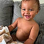 Coltan joined the competition — help win amazing prizes! bare_chest, blanket, child, comfort, couch, curly_hair, cute, expression, face, happy, indoors, living_room, person, playful, seated, skin, smiling, soft_texture, toddler, young