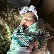 Emilia joined the competition — help win amazing prizes! newborn, baby, infant, wrapped, blanket, hospital, headband, bow, tattoo, hand, sleeping, peaceful, person, skin, portrait, closeup, indoor, soft_light, cute, newborn_baby