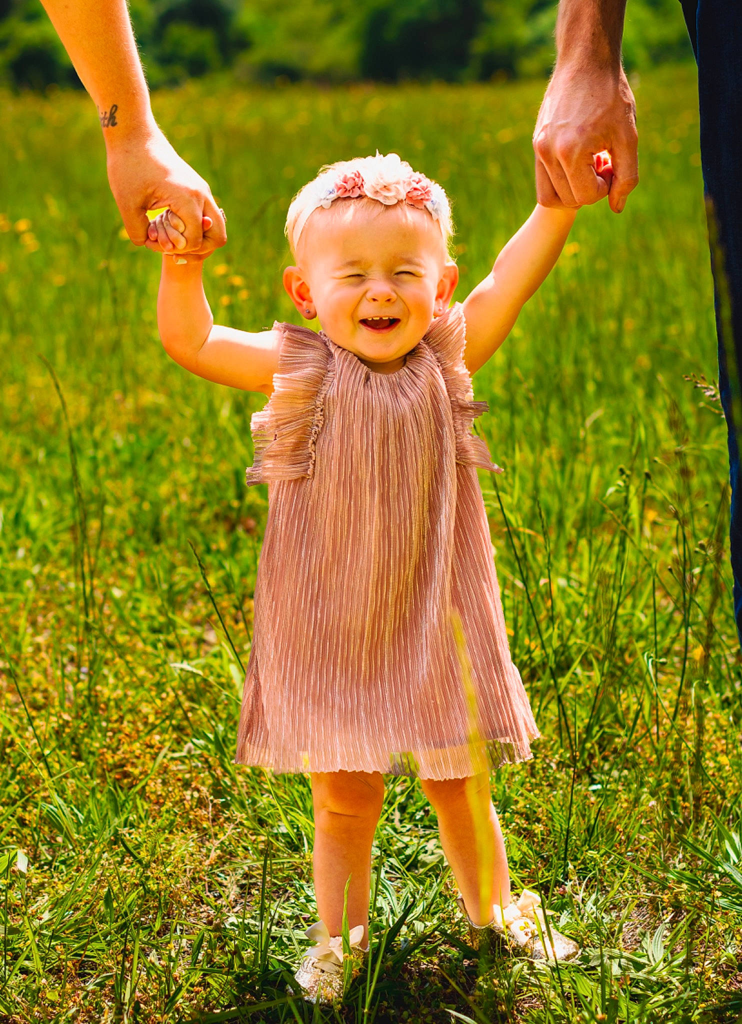 Madelyn joined the competition — help win amazing prizes! arm, baby_toddler_clothing, fawn, finger, fun, gesture, grass, grassland, hand, happy, joy, light, natural_environment, people_in_nature, person, pink, plant, skin, smile, sunlight