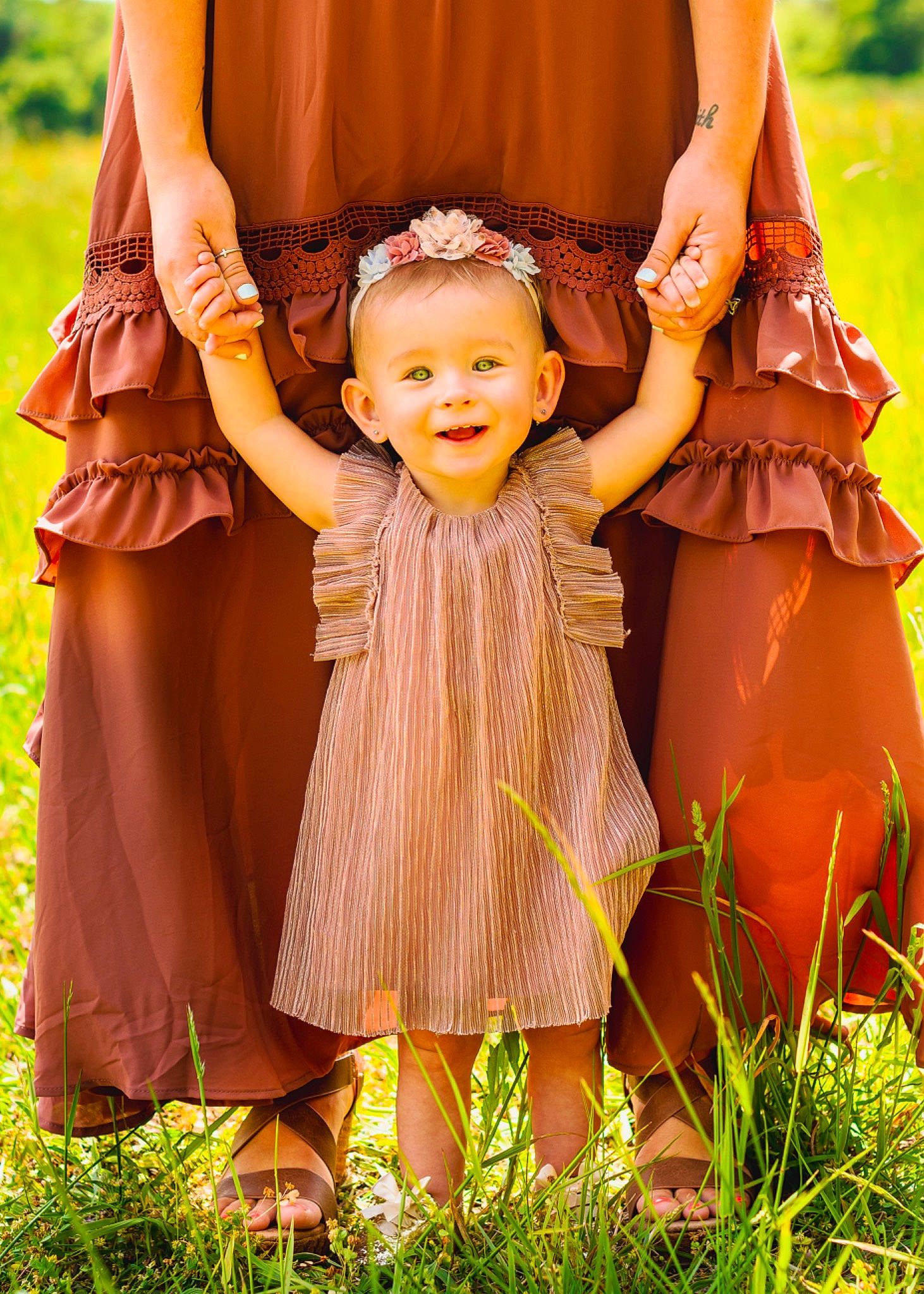 Madelyn joined the competition — help win amazing prizes! baby, baby_toddler_clothing, dress, facial_expression, finger, fun, gesture, grass, happy, human_body, joy, leaf, mammal, nature, outerwear, people_in_nature, person, photograph, pink, skin