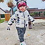 Maylon a rejoint le concours — aidez-le/la à gagner de superbes lots ! child, toddler, mickey_mouse, winter_clothing, puffer_jacket, beanie, hat, gloves, sneakers, bench, park, outdoor, walking, gravel, autumn, trees, smile, tongue, portrait, playful