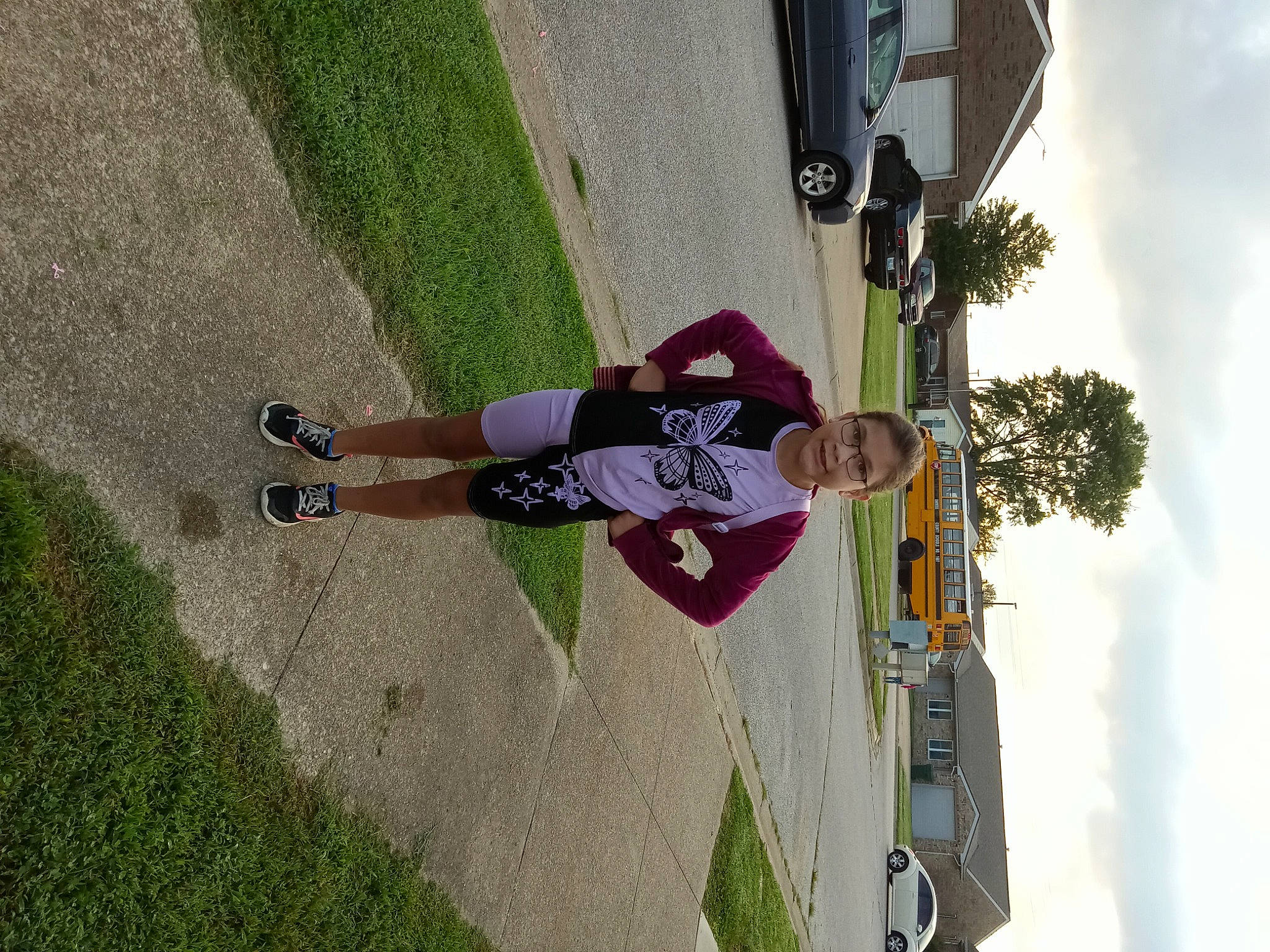 Susana is registered to the contest to win money with this photo: asphalt, car, cloud, extreme_sport, freeride, fun, grass, joy, leisure, outdoor_shoe, person, plant, recreation, rolling, shadow, sidewalk, sky, sports_equipment, tree, walking_shoe