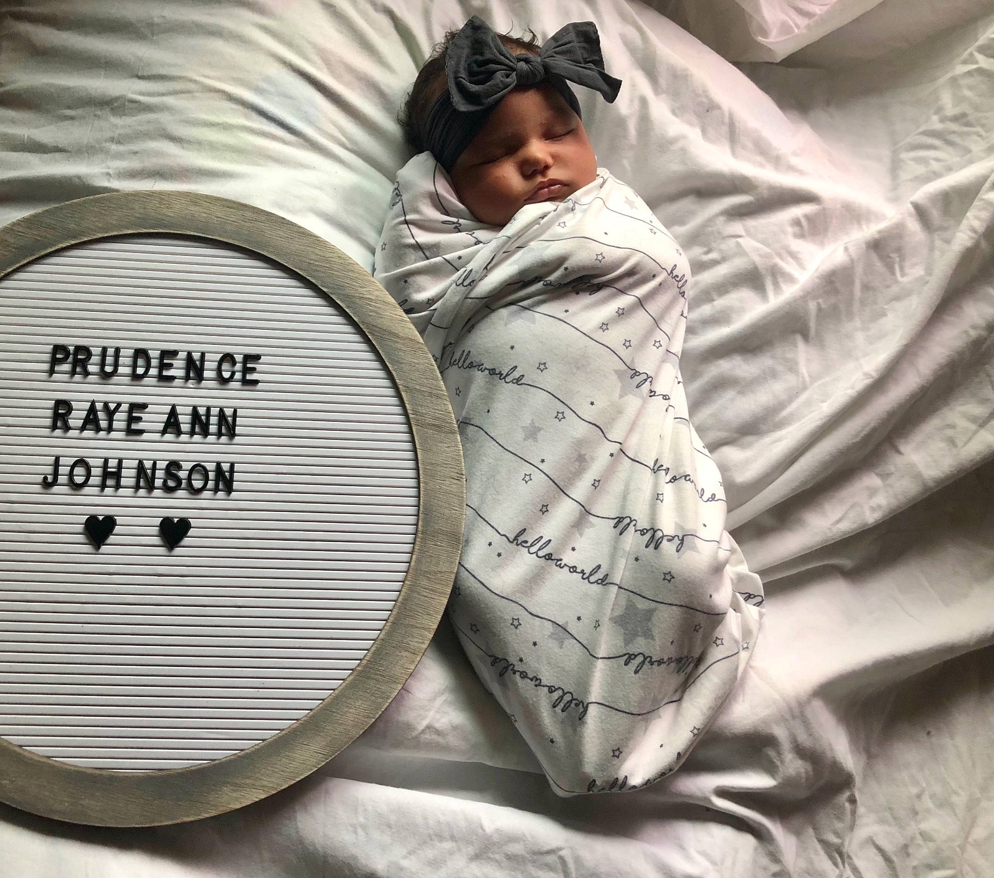 Prudence is registered to the contest to win money with this photo: automotive_wheel_system, baby, baby_products, baby_sleeping, bedding, circle, comfort, fashion_accessory, font, happy, hat, headwear, linens, mechanical_fan, nap, pattern, person, portrait_photography, sitting, textile