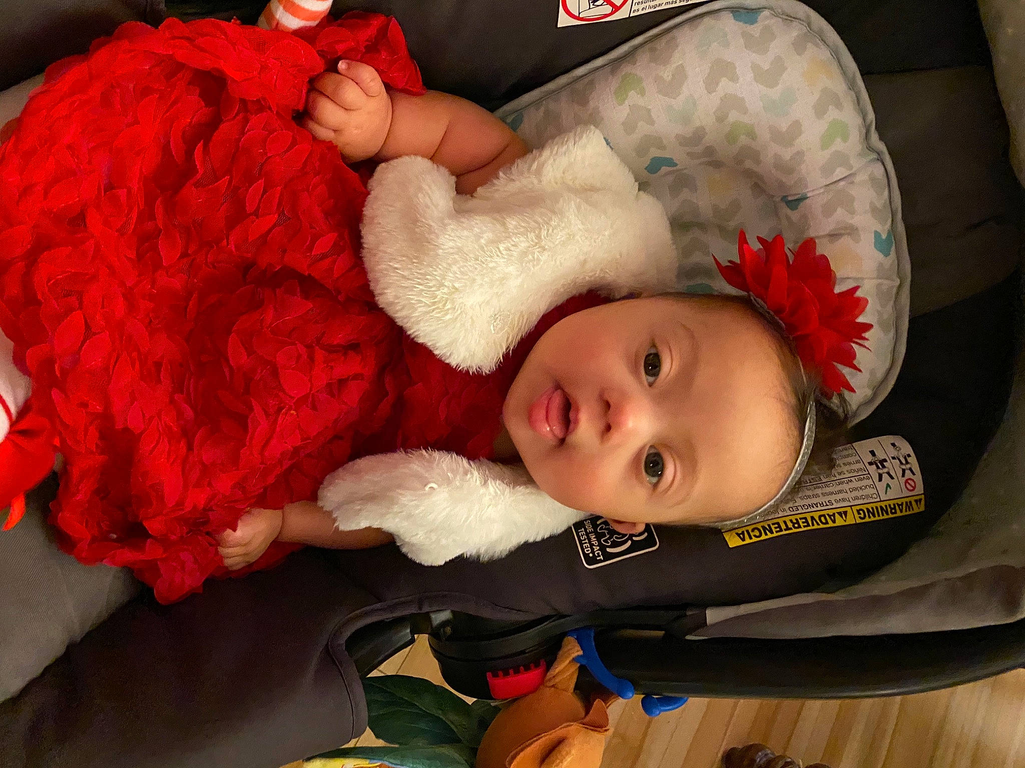 Victoria is registered to the contest to win money with this photo: baby, baby_products, baby_toddler_clothing, bedtime, christmas, comfort, costume, costume_accessory, fur, fur_clothing, hair_accessory, love, natural_material, person, plush, red, stuffed_toy, textile, velvet