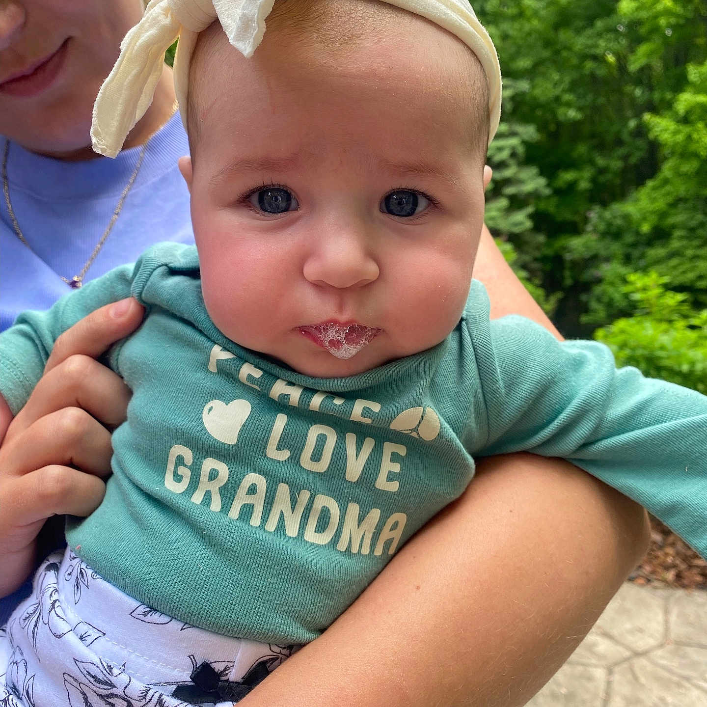 Josie is registered to the contest to win money with this photo: accessories, baby, clothing, cream, dessert, face, food, grass, hat, head, icecream, jewelry, necklace, person, photography, plant, portrait, sunglasses, t_shirt, tree