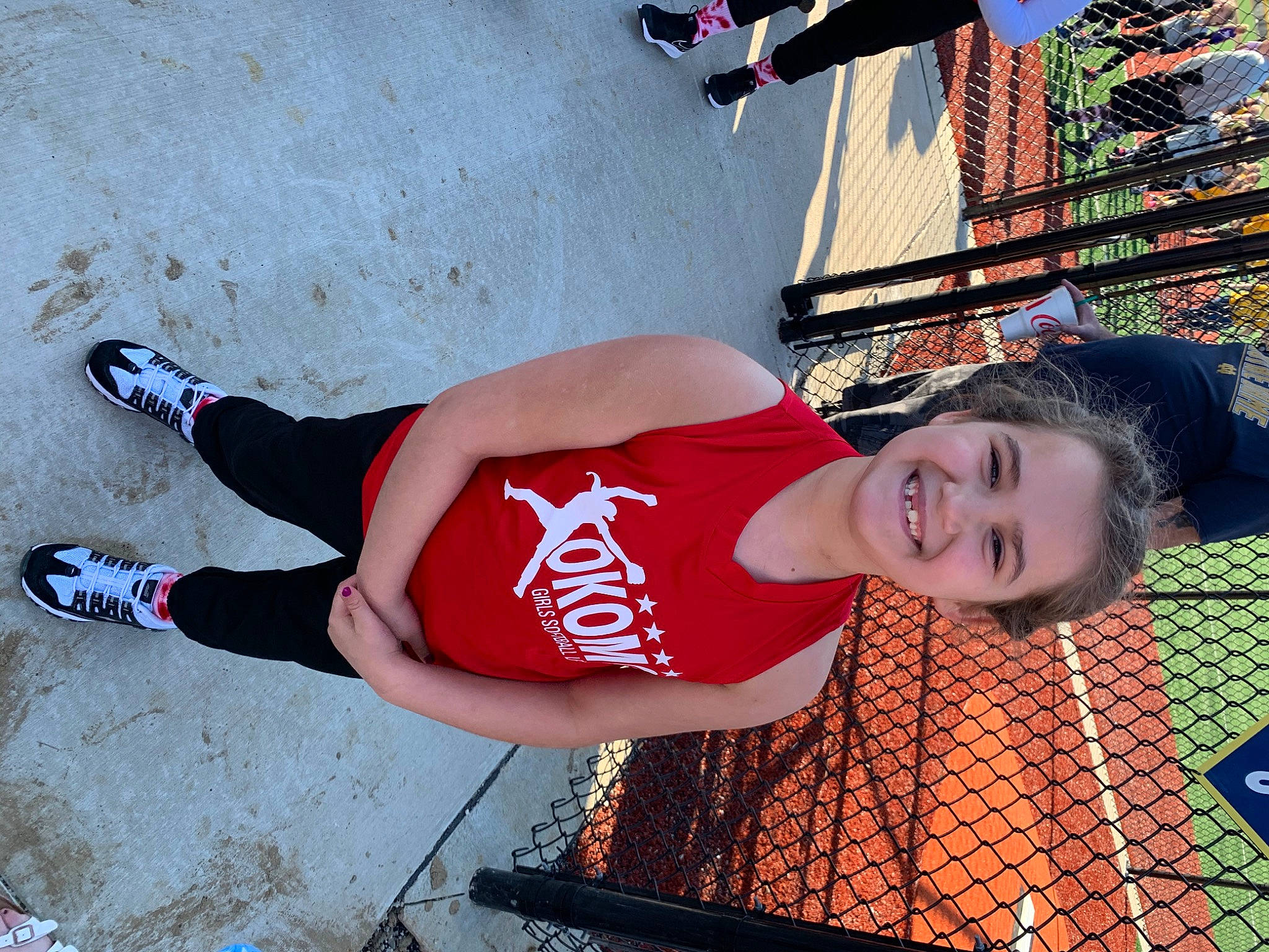 Victoria is registered to the contest to win money with this photo: beauty, chest, cool, elbow, fun, happy, human_leg, joy, knee, leg, leisure, orange, person, red, shoe, smile, street_fashion, textile, thigh, trunk