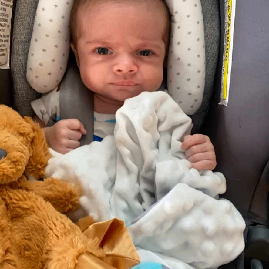 Maverick joined the competition — help win amazing prizes! baby, bed, blanket, bodypart, clothing, crib, cushion, face, finger, furniture, hand, hat, head, homedecor, infantbed, newborn, person, photography, portrait, transportation