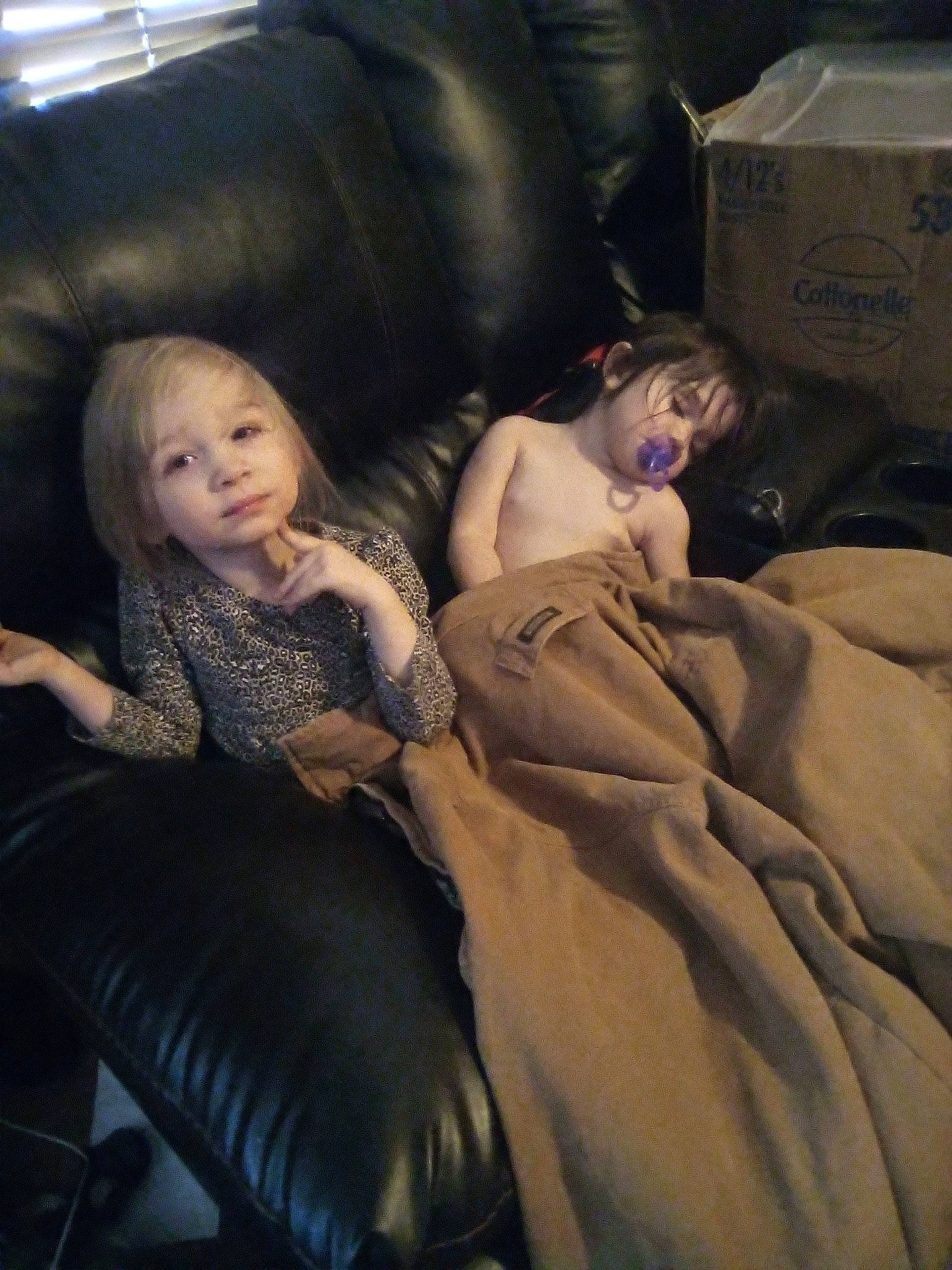 Crystal is registered to the contest to win money with this photo: black_hair, comfort, darkness, eye, facial_expression, flash_photography, floor, flooring, fun, head, human_body, interaction, lap, leg, long_hair, mouth, person, shipping_box, shoulder, thigh