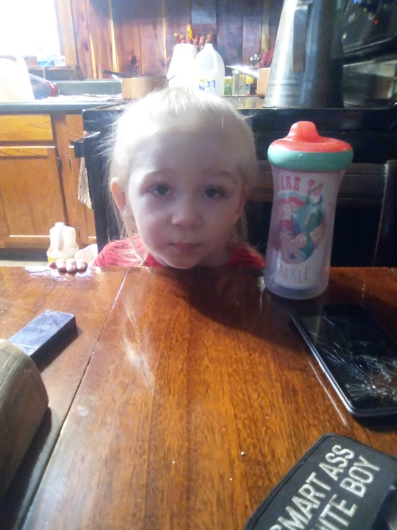 Crystal joined the competition — help win amazing prizes! chair, cheek, child, cup, desk, drink, drinkware, flooring, food, fun, hardwood, head, person, sitting, table, tableware, toddler, varnish, wood, wood_flooring