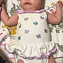 Adelynn joined the competition — help win amazing prizes! arms_outstretched, baby, butterfly_pattern, child, cute, face, floral_bedspread, head, indoors, infant, legs, lying_down, newborn, onesie, person, purple, skin, sleepwear, soft_lighting, white_clothing