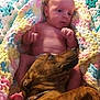 Dewey is registered to the contest to win money with this photo: baby, dog, blanket, crochet, pastel_colors, infant, pet, animal, child, resting, lying_down, cute, domestic_animal, friendship, indoor, cozy, soft_texture, warmth, companion, relaxation