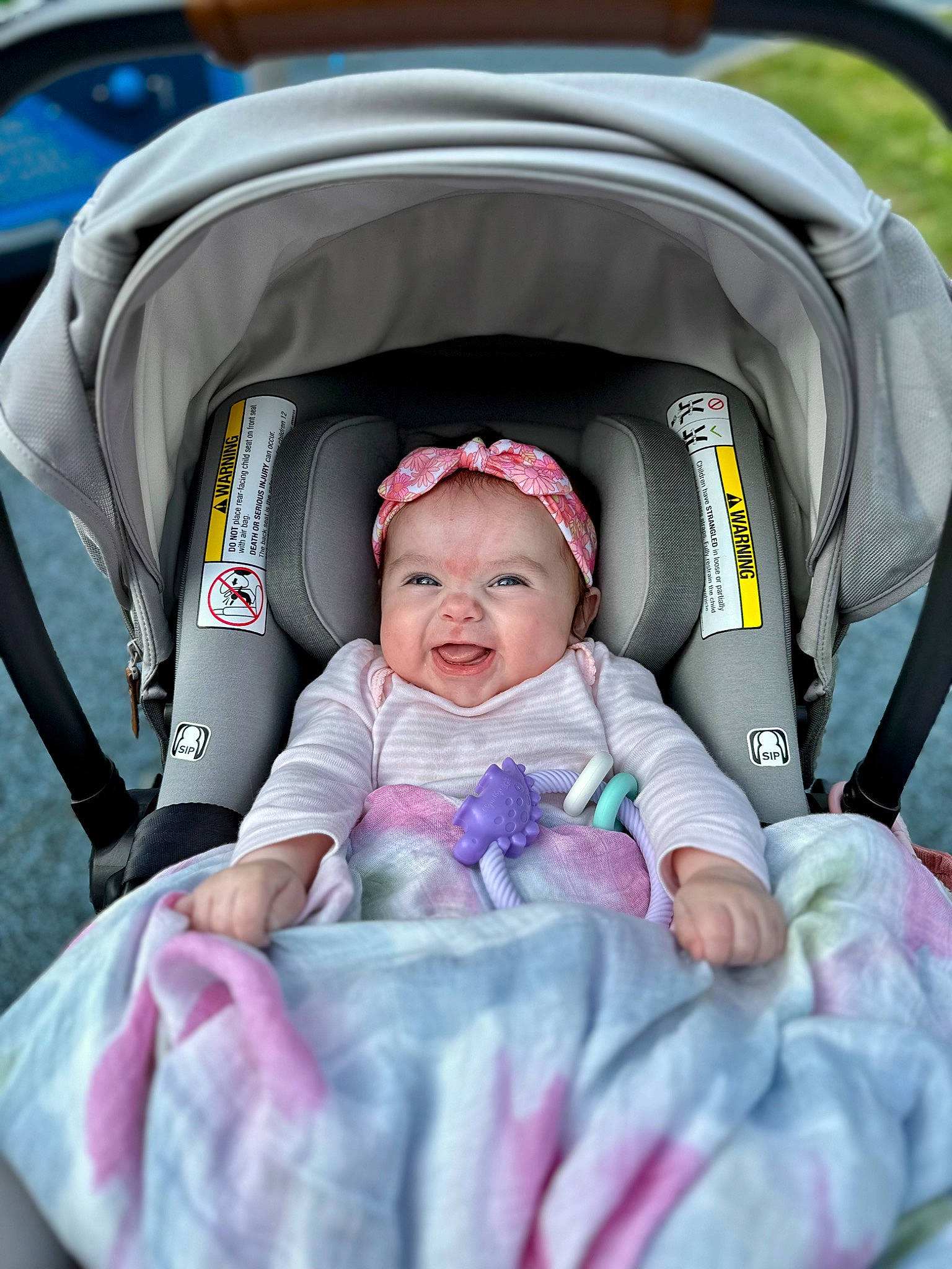 Allison is registered to the contest to win money with this photo: auto_part, baby, baby_carriage, baby_products, baby_toddler_clothing, beauty, car_seat, child, comfort, fun, happy, headwear, motor_vehicle, person, photograph, pink, product, purple, sitting, smile
