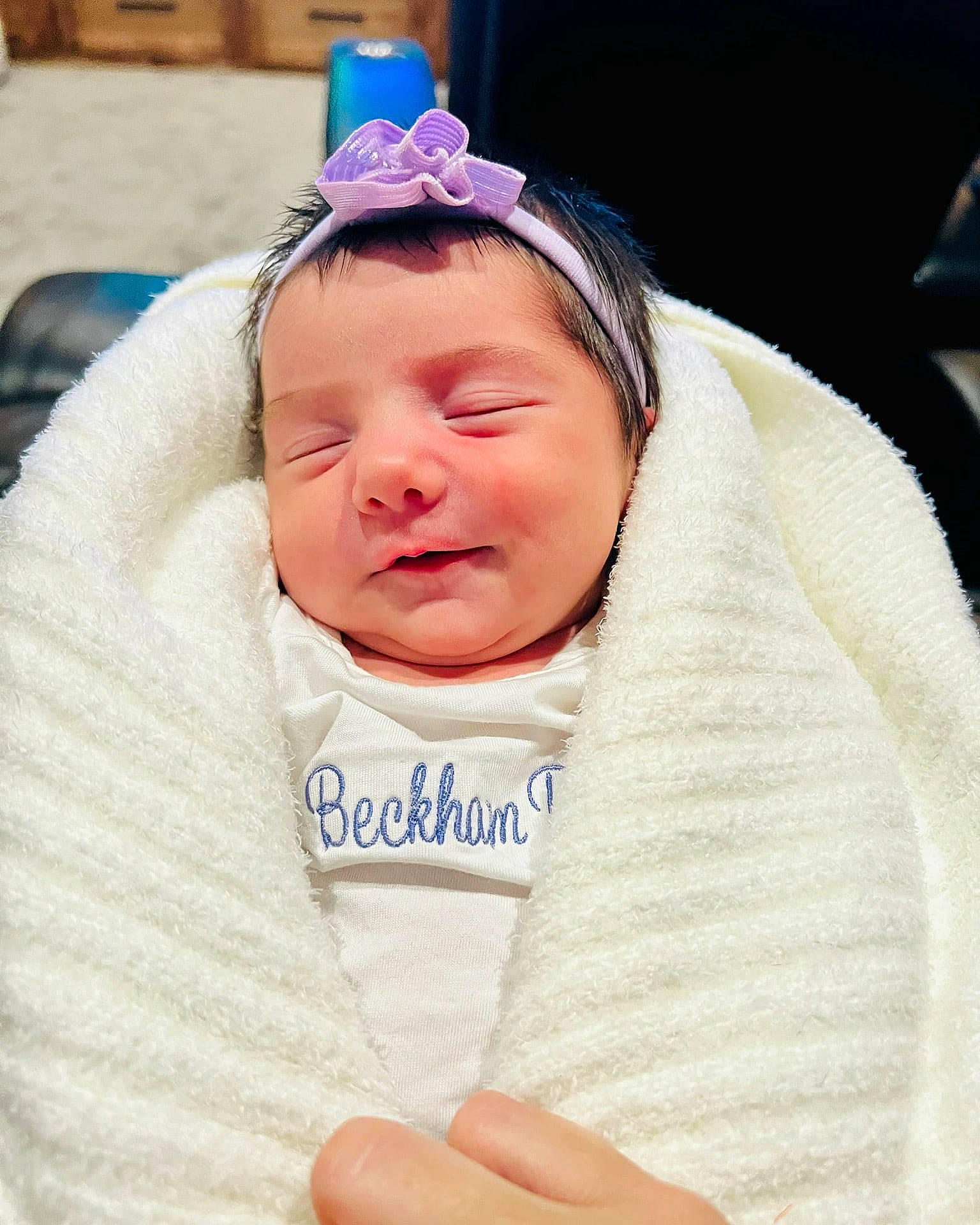 Beckham is registered to the contest to win money with this photo: baby, baby_products, baby_toddler_clothing, cheek, child, event, eyebrow, eyelash, eyewear, fashion_accessory, fun, happy, headband, headgear, headpiece, jewellery, linens, person, sitting, thumb