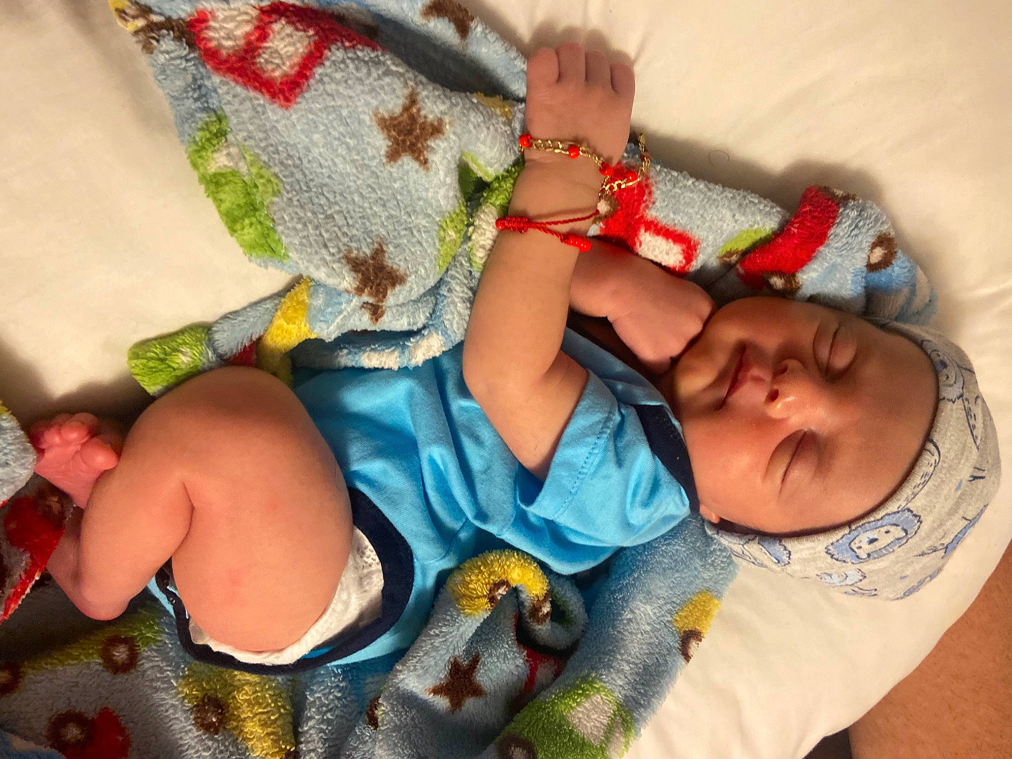 Damian joined the competition — help win amazing prizes! abdomen, arm, baby, baby_products, baby_sleeping, baby_toddler_clothing, child, comfort, finger, headwear, human_leg, linens, nail, pattern, person, product, sitting, skin, textile, thigh