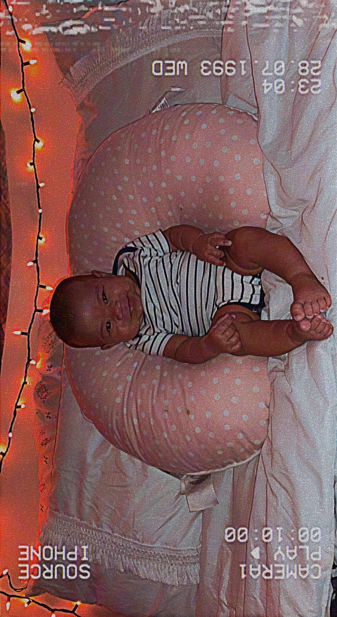 Aurorah is registered to the contest to win money with this photo: abdomen, arm, chest, child, comfort, elbow, facial_expression, flesh, font, gesture, hand, human_body, mouth, pattern, person, photo_caption, room, sitting, sleeve, stomach