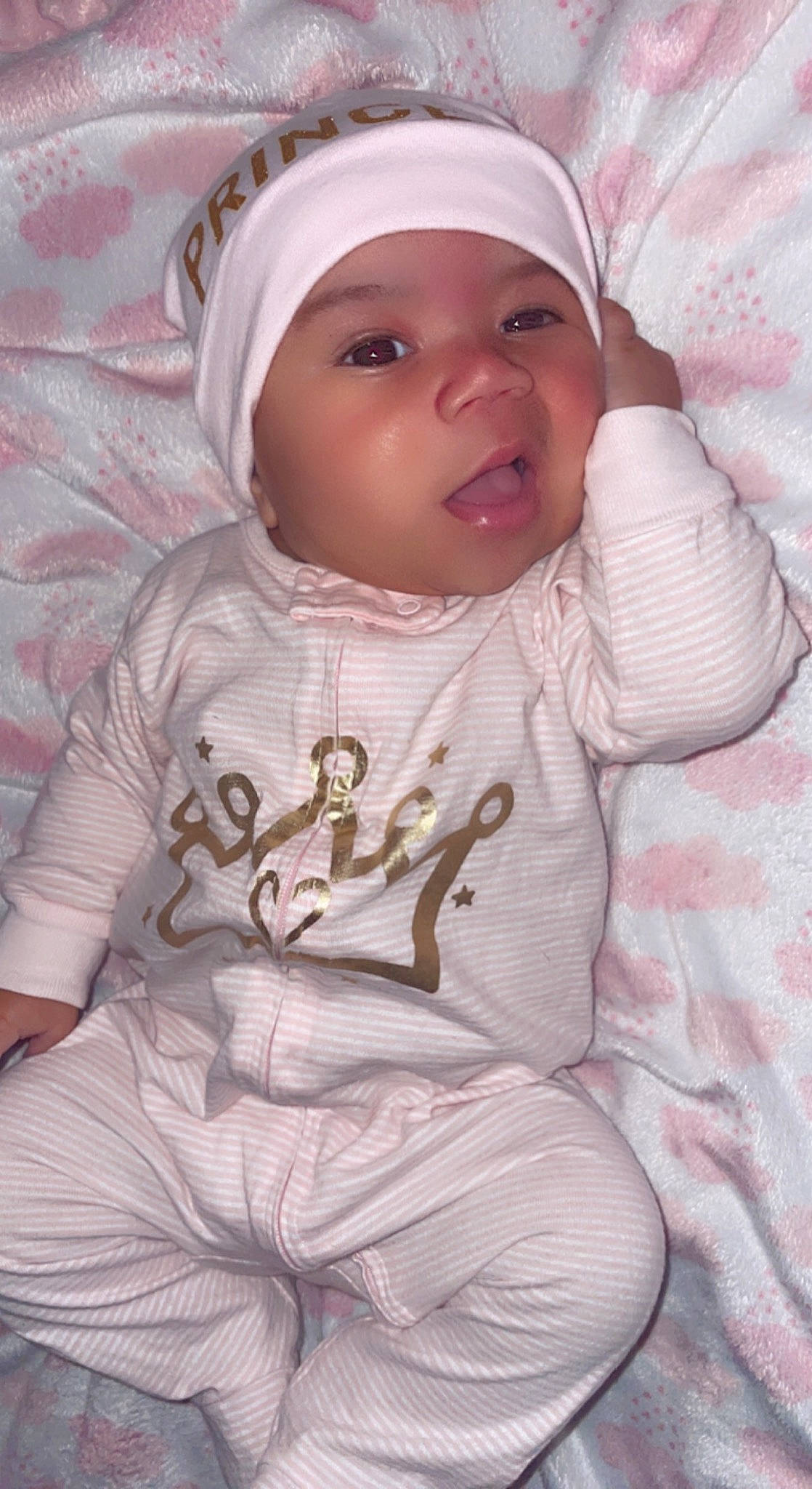 Aurorah is registered to the contest to win money with this photo: baby, baby_toddler_clothing, cap, cheek, child, comfort, eyebrow, happy, headwear, human_body, jacket, linens, lip, mouth, nose, person, pink, skin, sleeve, t_shirt