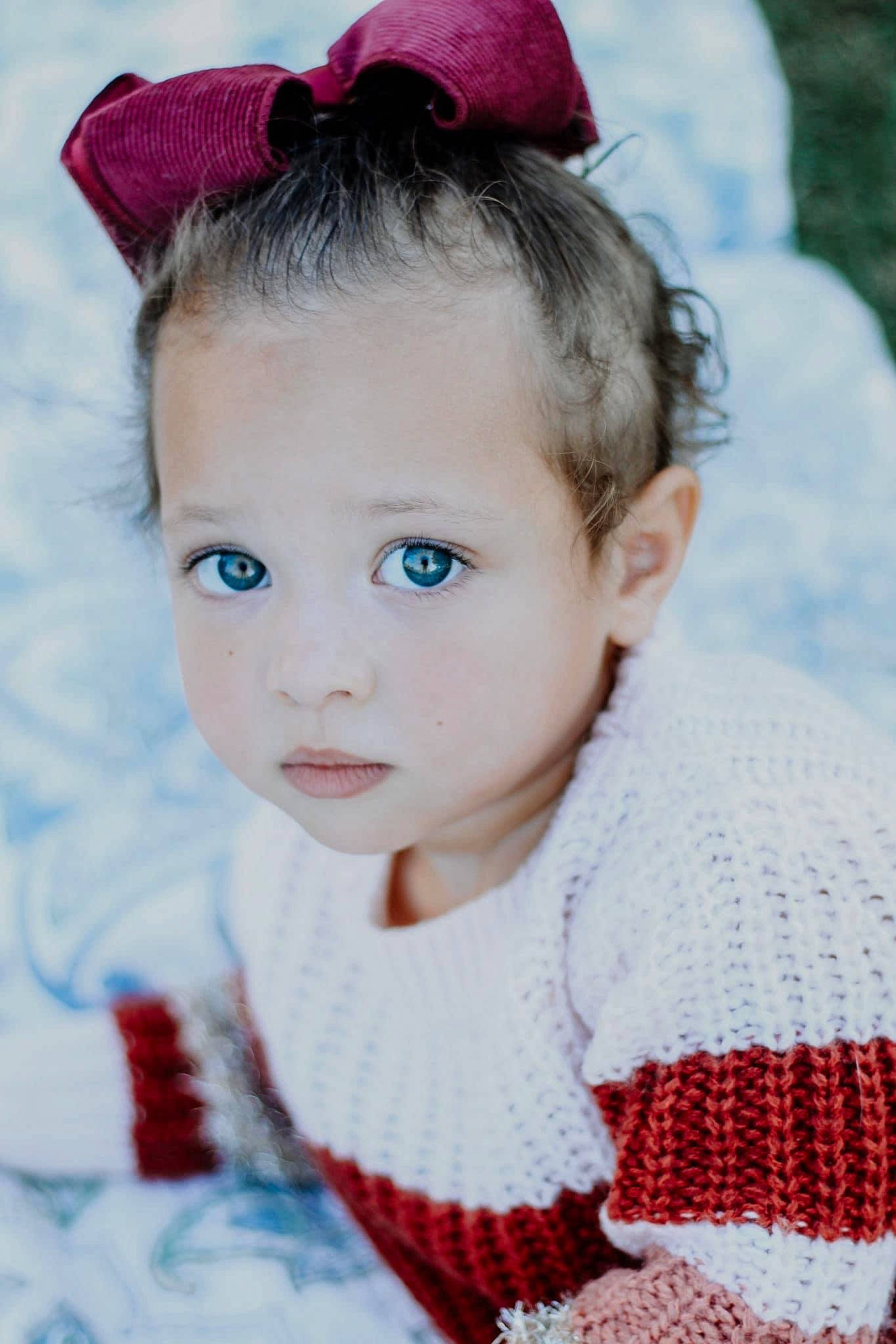 Journie joined the competition — help win amazing prizes! baby_toddler_clothing, blue, cheek, dress, eye, eyebrow, eyelash, happy, head, headgear, iris, lip, person, photograph, pink, red, skin, sleeve, textile, toddler