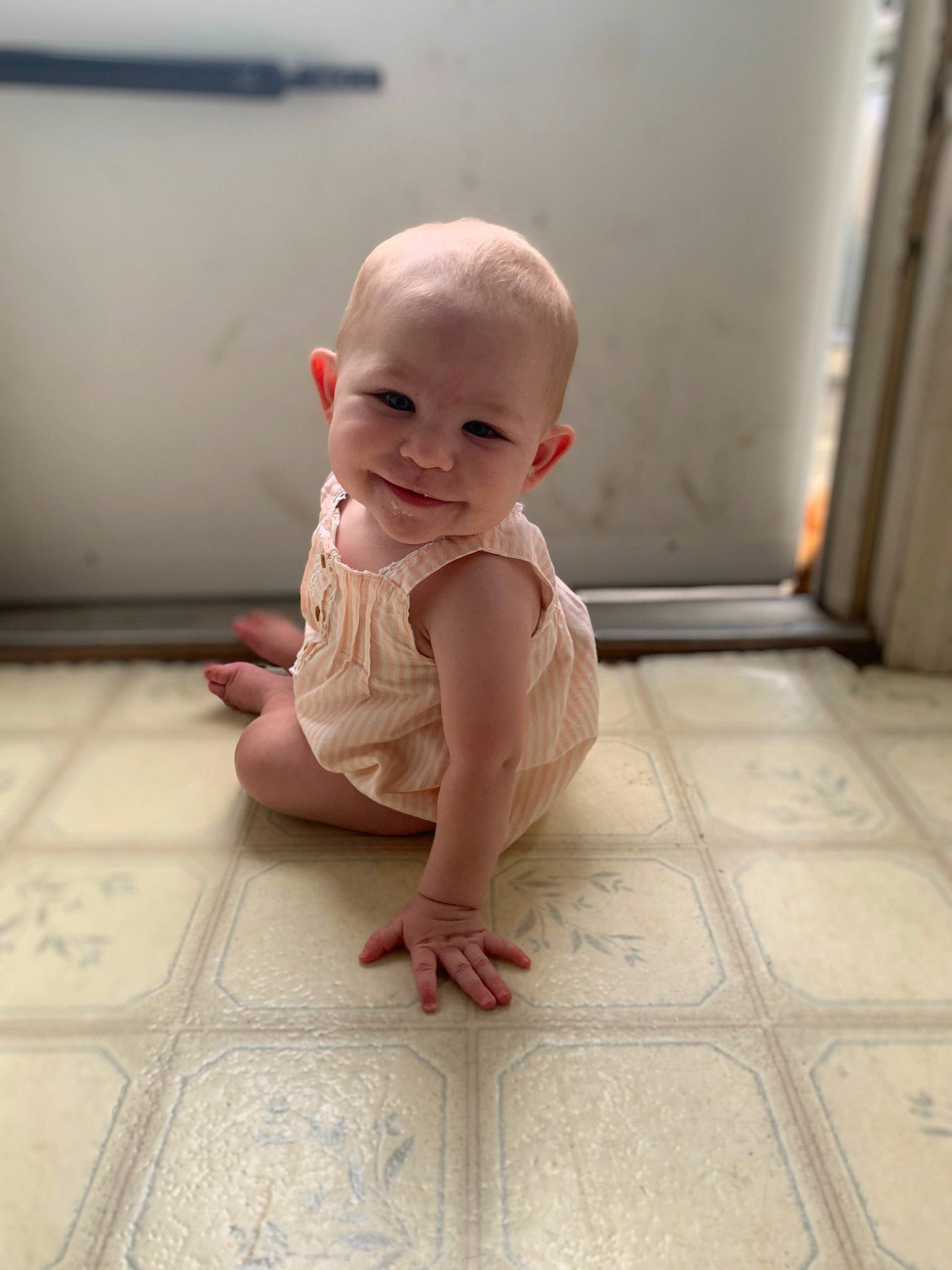 Isabell joined the competition — help win amazing prizes! baby, baby_toddler_clothing, barefoot, carmine, cheek, child, finger, floor, flooring, foot, happy, hardwood, head, human_leg, joy, person, room, sitting, skin, thumb